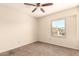 Bedroom with carpet, window and ceiling fan; simple and functional at 956 N 58Th St, Mesa, AZ 85205