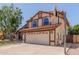 Beautiful home with a red tile roof, and a basketball hoop above the driveway at 956 N 58Th St, Mesa, AZ 85205