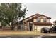 Charming two-story home featuring a red tile roof and a well-manicured front yard at 956 N 58Th St, Mesa, AZ 85205