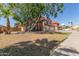 Charming two-story home with a red tile roof, large tree, and driveway at 956 N 58Th St, Mesa, AZ 85205