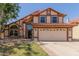 Charming two-story home with a red tile roof, and a two-car garage at 956 N 58Th St, Mesa, AZ 85205