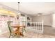 Inviting eat-in kitchen with a round table, tiled floor and counters, and a view into the living room at 956 N 58Th St, Mesa, AZ 85205