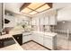 Bright kitchen with white cabinets, light countertops, tiled backsplash, and tile flooring at 956 N 58Th St, Mesa, AZ 85205