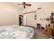 Main bedroom with vaulted ceiling, desk area, fan, and a large window at 956 N 58Th St, Mesa, AZ 85205