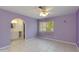 Serene bedroom with tile flooring, a ceiling fan, and an ensuite bathroom access at 962 E Greenway St, Mesa, AZ 85203