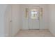 Inviting entryway featuring a decorative glass front door and neutral tile flooring at 962 E Greenway St, Mesa, AZ 85203