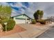 Street view of a well-kept single-story home with a two-car garage and desert landscaping at 962 E Greenway St, Mesa, AZ 85203