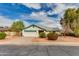 Charming single-story home features a well-manicured front yard and attached two-car garage at 962 E Greenway St, Mesa, AZ 85203