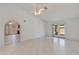 Bright and airy living room with tile flooring, ceiling fan, and access to the backyard at 962 E Greenway St, Mesa, AZ 85203