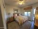 Comfortable bedroom featuring a floral-patterned bed, neutral walls, and natural light creating a relaxing retreat at 9750 N Monterey Dr # 67, Fountain Hills, AZ 85268