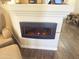 Contemporary electric fireplace with decorative mantel in living area at 9750 N Monterey Dr # 67, Fountain Hills, AZ 85268