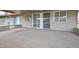 View of the covered back patio with a large area for outdoor seating and entertaining at 10317 W Desert Forest Cir, Sun City, AZ 85351