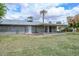 Well-maintained backyard with a covered patio, offering a tranquil outdoor space for relaxation and leisure at 10317 W Desert Forest Cir, Sun City, AZ 85351