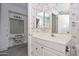 Bright bathroom featuring a white vanity and ample built-in storage space for a clean aesthetic at 10317 W Desert Forest Cir, Sun City, AZ 85351