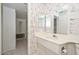 Cozy bathroom featuring wallpaper, vanity, and plenty of light at 10317 W Desert Forest Cir, Sun City, AZ 85351