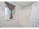 This bathroom offers a tub and shower combination, with a window letting in plenty of natural light at 10317 W Desert Forest Cir, Sun City, AZ 85351