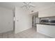 Kitchen features tile flooring, breakfast bar, and access to other rooms at 10317 W Desert Forest Cir, Sun City, AZ 85351