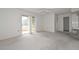 Neutral colored living room with access to exterior at 10317 W Desert Forest Cir, Sun City, AZ 85351