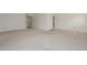Spacious living room with neutral carpet and an abundance of natural light at 10317 W Desert Forest Cir, Sun City, AZ 85351