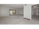 Spacious living room featuring neutral carpet and easy access to other rooms at 10317 W Desert Forest Cir, Sun City, AZ 85351