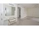 Main bedroom featuring vanity table, access to bathroom and closet space at 10317 W Desert Forest Cir, Sun City, AZ 85351