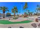 Outdoor putting green on a course with mature trees at 10317 W Desert Forest Cir, Sun City, AZ 85351