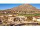 Stunning aerial view of a Southwestern home showcasing mountain views and a golf course at 10801 E Happy Valley Rd # 86, Scottsdale, AZ 85255