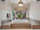 Relaxing bathroom showcasing a standalone tub with views of the outdoor landscape at 10801 E Happy Valley Rd # 86, Scottsdale, AZ 85255