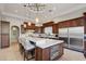 Stunning kitchen with an island, stainless appliances, and custom dark wood cabinetry at 10801 E Happy Valley Rd # 86, Scottsdale, AZ 85255