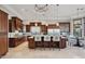 Gourmet kitchen with dark wood cabinets, a large island, and stainless steel appliances at 10801 E Happy Valley Rd # 86, Scottsdale, AZ 85255