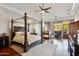 Luxurious primary bedroom features a fireplace, sitting area, and a four-poster bed at 10801 E Happy Valley Rd # 86, Scottsdale, AZ 85255