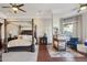 Tranquil primary bedroom with a sitting area, fireplace, and canopy bed at 10801 E Happy Valley Rd # 86, Scottsdale, AZ 85255