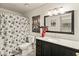Bathroom features a shower-tub combination with modern finishes and an ornate mirror above the sink at 11333 N 92Nd St # 1021, Scottsdale, AZ 85260