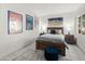 Bedroom features colorful art prints and a plush rug at 11333 N 92Nd St # 1021, Scottsdale, AZ 85260