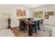 Dining area featuring a large wooden table with seating for six and colorful artwork at 11333 N 92Nd St # 1021, Scottsdale, AZ 85260