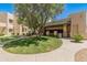 Exterior of building with green lawn and shrubs, sidewalk, mailbox station, and parking in the background at 11333 N 92Nd St # 1021, Scottsdale, AZ 85260