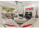 Cozy living room with a fireplace, modern ceiling fan, and sliding glass doors to a patio at 11333 N 92Nd St # 1021, Scottsdale, AZ 85260