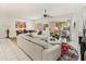 Bright living room with a fireplace, tile flooring, a white sectional, and access to an outdoor patio at 11333 N 92Nd St # 1021, Scottsdale, AZ 85260