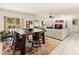 Open living space with a large wooden table, comfortable seating, and a view of the outdoors at 11333 N 92Nd St # 1021, Scottsdale, AZ 85260
