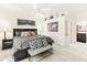Comfortable bedroom with a ceiling fan, wall art, and access to an attached bathroom at 11333 N 92Nd St # 1021, Scottsdale, AZ 85260