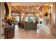 Spacious living room featuring a beamed ceiling, fireplace, and scenic views at 11409 E Juan Tabo Rd, Scottsdale, AZ 85255