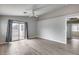 Bright, open living room with sliding glass doors, neutral tones and views of the backyard at 15984 W Watkins St, Goodyear, AZ 85338