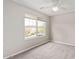 Bedroom featuring a ceiling fan and a large window offering views of the neighborhood at 16425 N 172Nd Ln, Surprise, AZ 85388