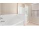 Bright bathroom featuring a shower and separate tub at 17358 N 185Th Ln, Surprise, AZ 85374
