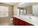 Bathroom features double sinks, tile floors and a large mirror at 17358 N 185Th Ln, Surprise, AZ 85374