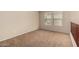 Spacious room with multiple windows providing ample light and neutral carpet at 17358 N 185Th Ln, Surprise, AZ 85374