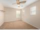 Bright bedroom featuring a ceiling fan and ample windows for plenty of natural light at 17358 N 185Th Ln, Surprise, AZ 85374
