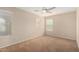 Neutral bedroom with multiple windows and a ceiling fan for added comfort at 17358 N 185Th Ln, Surprise, AZ 85374