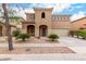 Charming two-story home featuring a unique architectural style with a tiled roof and a well-maintained front yard at 17358 N 185Th Ln, Surprise, AZ 85374