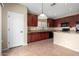 Bright kitchen features granite countertops, ample cabinet space, and a modern pendant light at 17358 N 185Th Ln, Surprise, AZ 85374